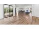 Spacious living room with hardwood floors and sliding glass doors at 9116 Exposition Dr, Tampa, FL 33626