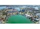 Stunning aerial view of the waterfront neighborhood and marina at 10355 Paradise Blvd # 207, Treasure Island, FL 33706