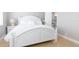 Charming bedroom with a white queen-size bed and en-suite bathroom at 10355 Paradise Blvd # 207, Treasure Island, FL 33706
