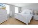 Bright and airy bedroom with white furniture and ample closet space at 10355 Paradise Blvd # 207, Treasure Island, FL 33706