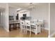 Modern dining area with white table and chairs at 10355 Paradise Blvd # 207, Treasure Island, FL 33706