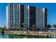 Highrise building exterior, waterfront with boat slips at 10355 Paradise Blvd # 207, Treasure Island, FL 33706