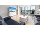 Relaxing living room with water views and comfy seating at 10355 Paradise Blvd # 207, Treasure Island, FL 33706
