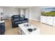 Living room with hardwood floors and white furniture at 10355 Paradise Blvd # 207, Treasure Island, FL 33706