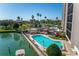 Community pool and sundeck area with canal views at 10355 Paradise Blvd # 207, Treasure Island, FL 33706