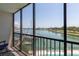 Spacious balcony overlooking the marina, boats, and sparkling water at 10355 Paradise Blvd # 207, Treasure Island, FL 33706