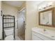 Bathroom with vanity, toilet and walk-in shower at 10704 Mira Vista Dr, Port Richey, FL 34668