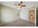 Bright bedroom with ceiling fan and large closet at 10704 Mira Vista Dr, Port Richey, FL 34668