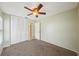 Comfortable bedroom with ceiling fan and neutral decor at 10704 Mira Vista Dr, Port Richey, FL 34668