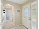 Inviting entryway with tiled floors and arched hallway at 10704 Mira Vista Dr, Port Richey, FL 34668