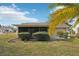 House exterior showcasing screened patio and landscaping at 10704 Mira Vista Dr, Port Richey, FL 34668