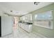 White kitchen cabinets, granite countertops, and appliances at 10704 Mira Vista Dr, Port Richey, FL 34668