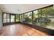 Spacious sunroom with screened windows and tile floors at 10704 Mira Vista Dr, Port Richey, FL 34668