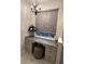 Elegant bathroom vanity with granite countertop and a chandelier at 10880 Cory Lake Dr, Tampa, FL 33647