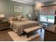 Spacious bedroom with a king-size bed and neutral decor at 10880 Cory Lake Dr, Tampa, FL 33647