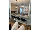 Modern kitchen with breakfast bar, stainless steel appliances, and granite countertops at 10880 Cory Lake Dr, Tampa, FL 33647