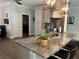 Large kitchen island with seating for four and granite countertop at 10880 Cory Lake Dr, Tampa, FL 33647