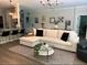 Comfortable living room with sectional sofa and coffee table at 10880 Cory Lake Dr, Tampa, FL 33647