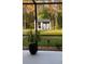 Relaxing screened patio with view of backyard shed and trees at 10880 Cory Lake Dr, Tampa, FL 33647