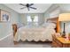 Sleigh bed in a bedroom with ceiling fan at 12331 Wild Acres Rd, Largo, FL 33773