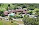 Aerial view of community clubhouse, pool, and golf course at 12708 N 52Nd St, Temple Terrace, FL 33617