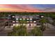 Dusk aerial view of modern building with retail space and residential units above at 13 29Th N St, St Petersburg, FL 33713