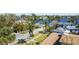 Elevated view of property on a tree-lined street at 136 26Th Ne Ave, St Petersburg, FL 33704