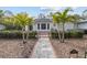 Charming home exterior with walkway and lush landscaping at 136 26Th Ne Ave, St Petersburg, FL 33704