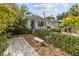 House exterior with lush landscaping and stone path at 136 26Th Ne Ave, St Petersburg, FL 33704
