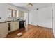 Kitchen with light cabinets, hardwood floors, and black appliances at 136 26Th Ne Ave, St Petersburg, FL 33704