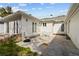 Back patio with brick wall and seating area at 136 26Th Ne Ave, St Petersburg, FL 33704