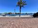 Brick road leads to waterfront with palm trees and calm water at 136 26Th Ne Ave, St Petersburg, FL 33704