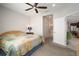 Bright bedroom with a king-size bed and access to bathroom at 13607 Circa Crossing Dr, Lithia, FL 33547