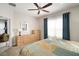 Serene bedroom with a dresser and large windows at 13607 Circa Crossing Dr, Lithia, FL 33547