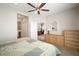 Comfortable bedroom with dresser and view of sitting area at 13607 Circa Crossing Dr, Lithia, FL 33547