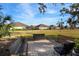 Community lawn with benches and mature trees providing a relaxing outdoor space at 13607 Circa Crossing Dr, Lithia, FL 33547