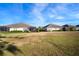 Community backyard view showing houses and well-maintained lawn at 13607 Circa Crossing Dr, Lithia, FL 33547