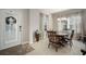 Dining room with wooden table, chairs, and hutch at 13607 Circa Crossing Dr, Lithia, FL 33547
