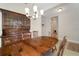 Dining room with large hutch and chandelier at 13607 Circa Crossing Dr, Lithia, FL 33547