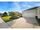 House exterior with attached garage and well-maintained lawn at 13607 Circa Crossing Dr, Lithia, FL 33547