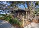 Screened gazebo with a ramp, offering a shaded and accessible area at 13607 Circa Crossing Dr, Lithia, FL 33547