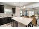 Open concept kitchen features an island and seating at 13607 Circa Crossing Dr, Lithia, FL 33547