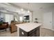 Kitchen island with white countertop, offering extra prep space at 13607 Circa Crossing Dr, Lithia, FL 33547