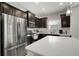 Stainless steel refrigerator and kitchen island at 13607 Circa Crossing Dr, Lithia, FL 33547