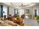 Relaxing living room with hardwood floors and access to a patio at 13607 Circa Crossing Dr, Lithia, FL 33547