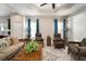 Living room features two leather recliners and a coffee table at 13607 Circa Crossing Dr, Lithia, FL 33547