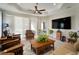 Spacious living room with large TV and comfy seating at 13607 Circa Crossing Dr, Lithia, FL 33547