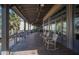 Relaxing outdoor porch with rocking chairs, offering a peaceful view at 13607 Circa Crossing Dr, Lithia, FL 33547