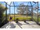 Bright and airy screened porch with view of nature at 13607 Circa Crossing Dr, Lithia, FL 33547
