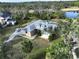 Aerial view of a single-Gathering home with a large backyard and a pond nearby at 13653 Heritage Way, Sarasota, FL 34240